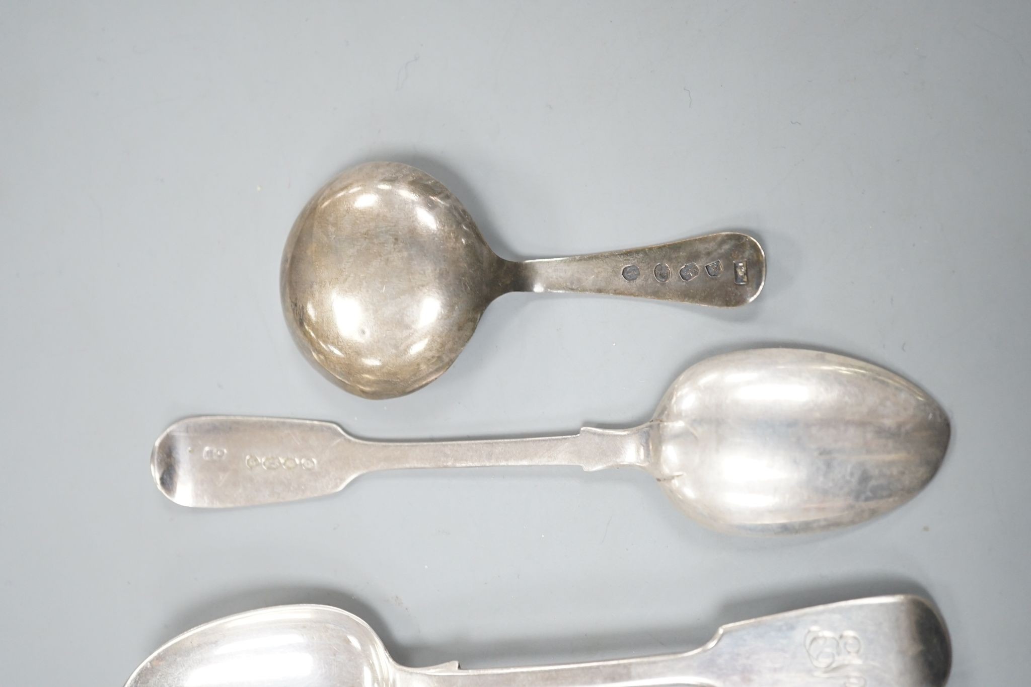 A set of six early Victorian silver fiddle pattern teaspoons, Charles Boyton, London, 1844 and a George IV silver caddy spoon, Birmingham, 1821, 3.5oz.